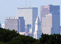 Boston will be the host city for the Democratic National Convention.  This view shows Boston as viewed from Vinegar Hill in Saugus Massachusetts.  The image was made using a 100-300 MM zoom lens on a Canon10D camera.  Both the large and small versions of this image are cropped from the original.  The trees in the foreground are on the hill which runs along Winter St.